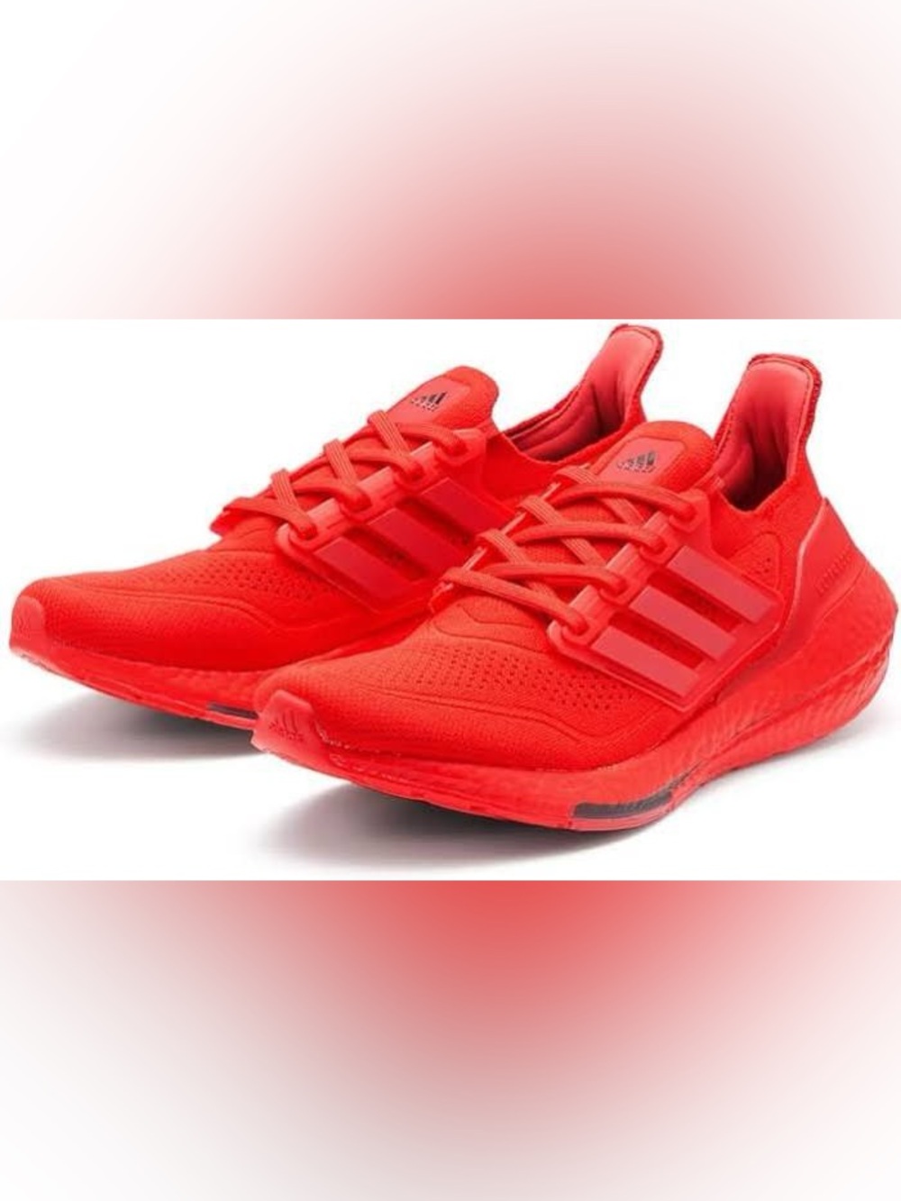 Adidas Ultraboost 21 running shoes in the "Vivid Red" colorway